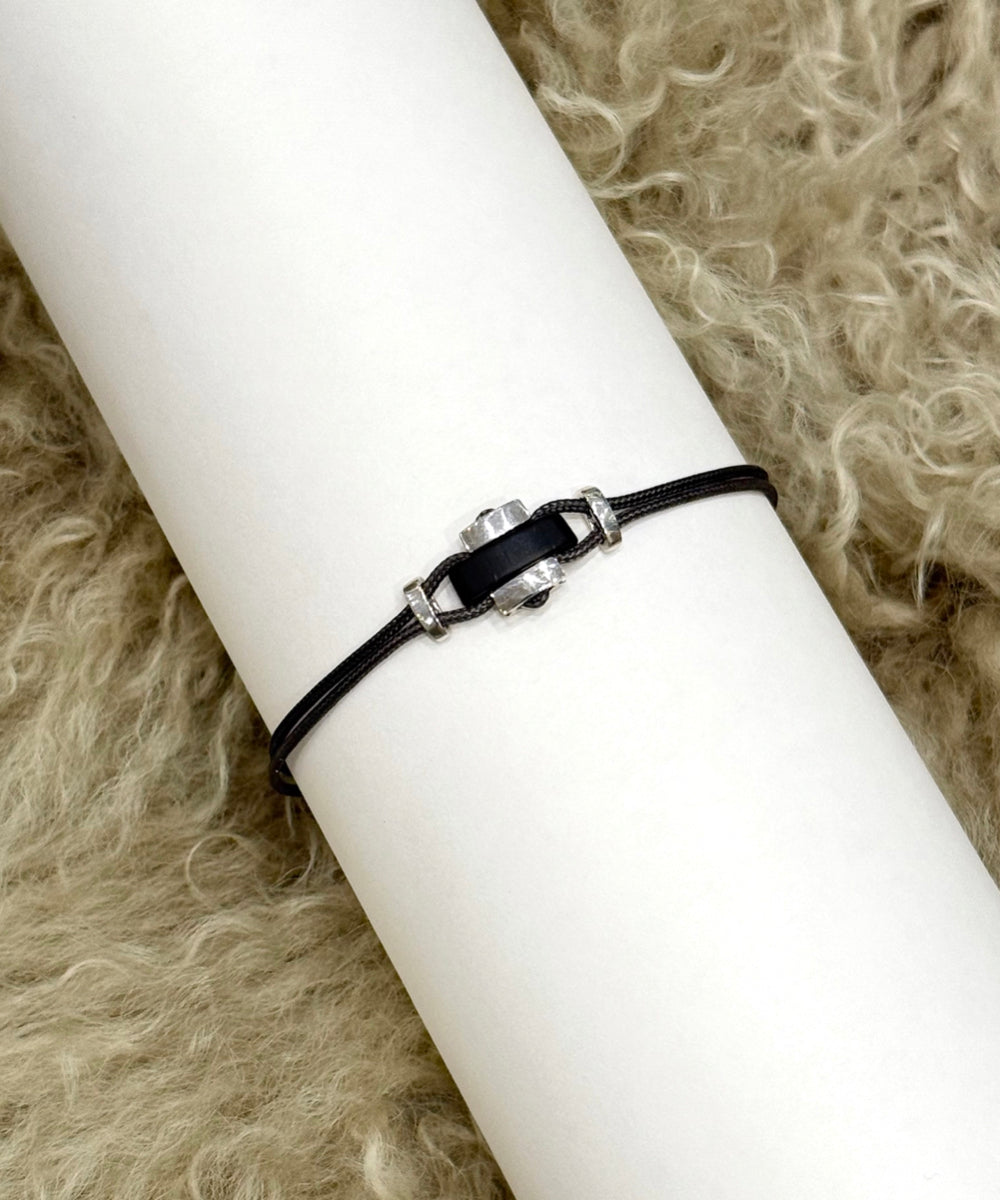 Cord bracelet with horn and sterling silver elements