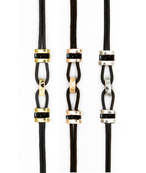 Parachute cord bracelet accented with gold and sustainable horn links. Unisex, refined, and waterproof—precious yet made to be worn every day.