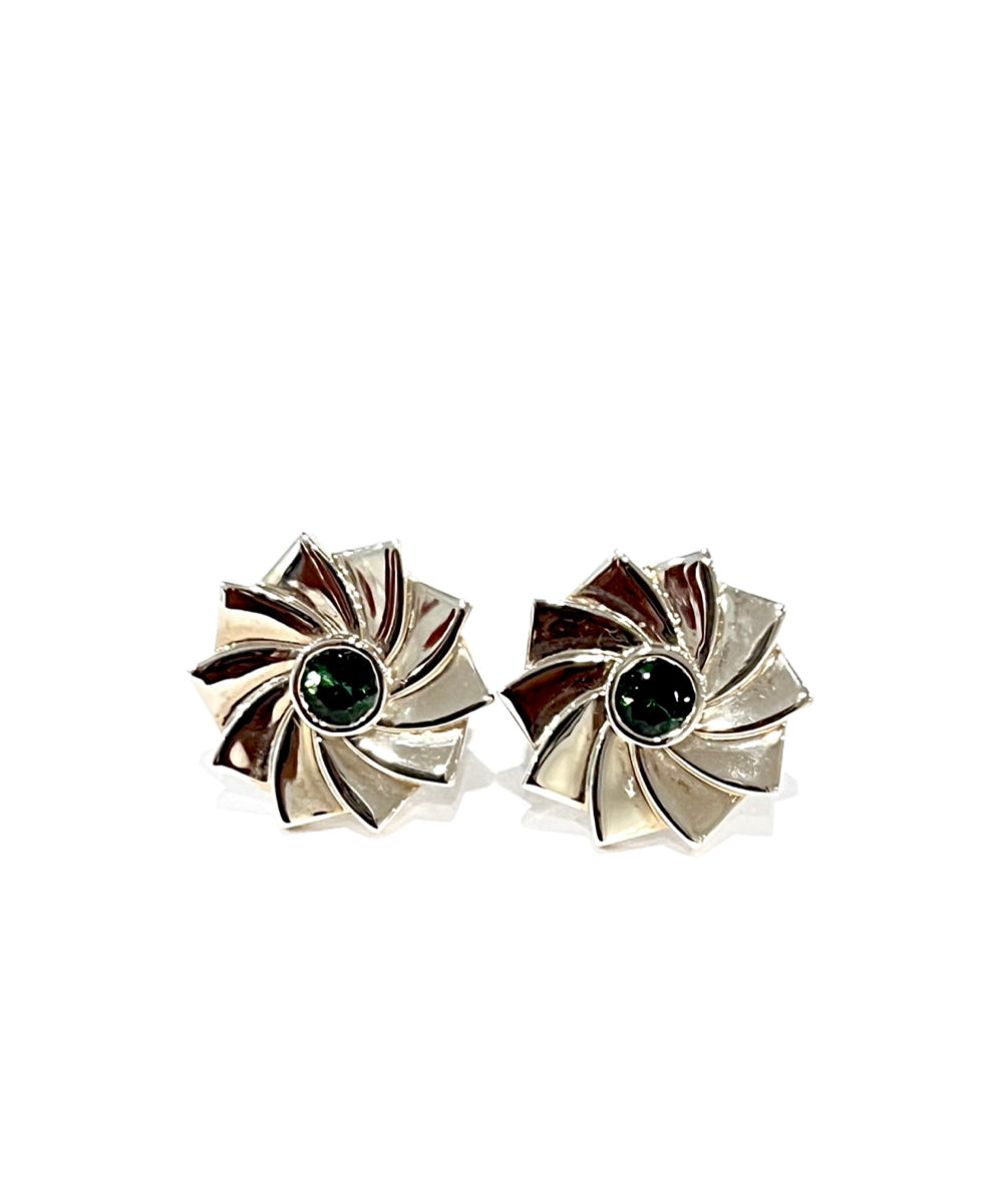 Elegant Cassimir cufflinks in sterling silver with a striking turbine-inspired design and deep green gemstone center. Luxury men's jewelry by ZADEH, handcrafted for timeless sophistication.