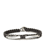 Grey braided bracelet with silver designs on a white background | ZADEH NY