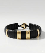 ZADEH NY GRANT HORN GOLD wide link bracelet featuring sustainable black buffalo horn and 10K yellow gold accents on a grey background.