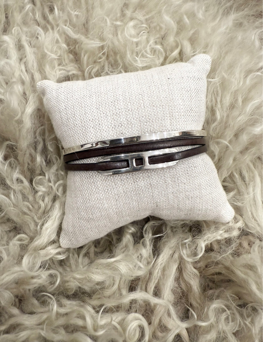Handcrafted men's bracelet stack featuring double leather wrap with bold sterling silver detail and a minimalist silver cuff. ZADEH NY, made in NY
