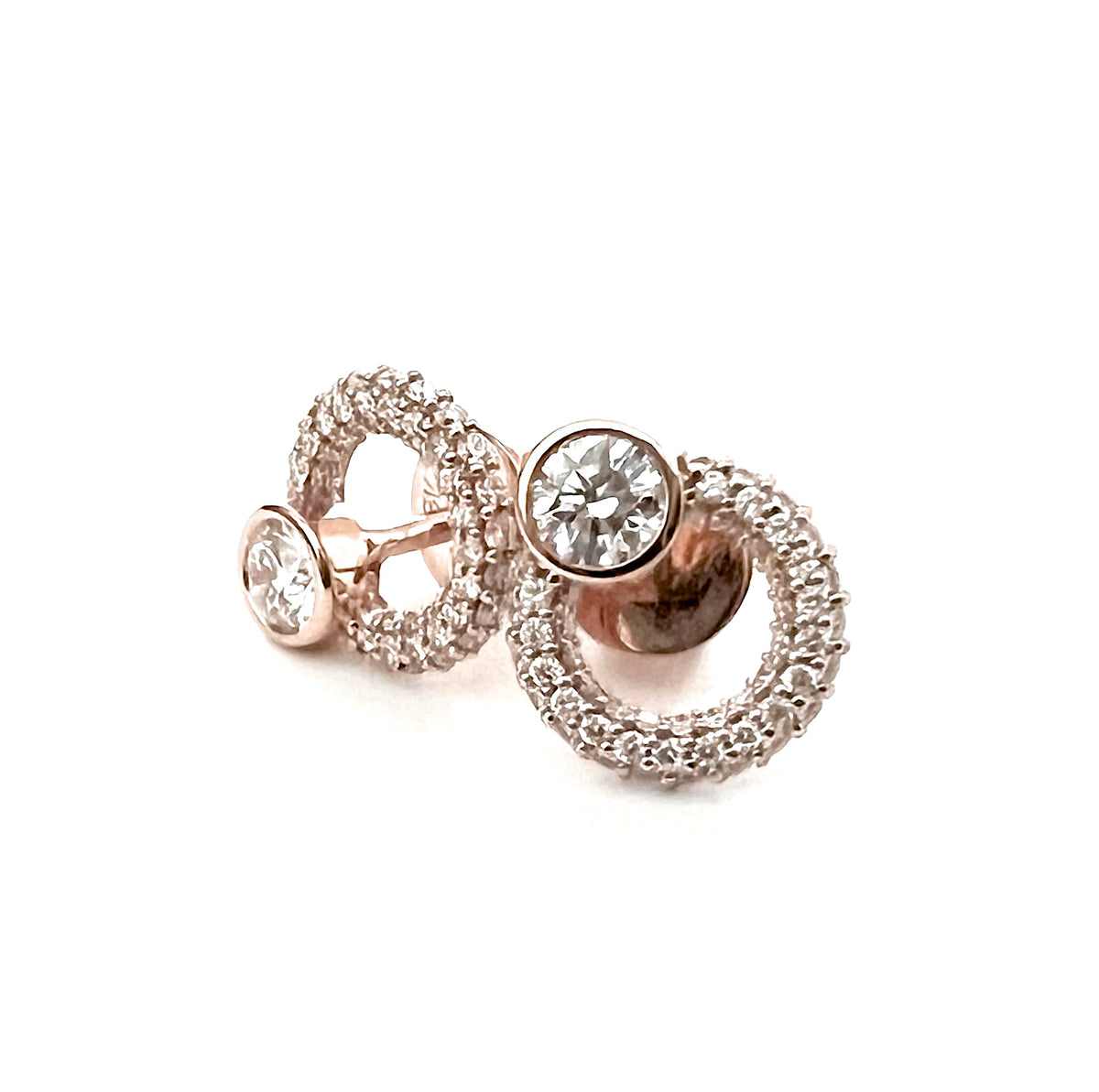 A pair of 18K rose gold Isabel earrings featuring micro pave diamonds.