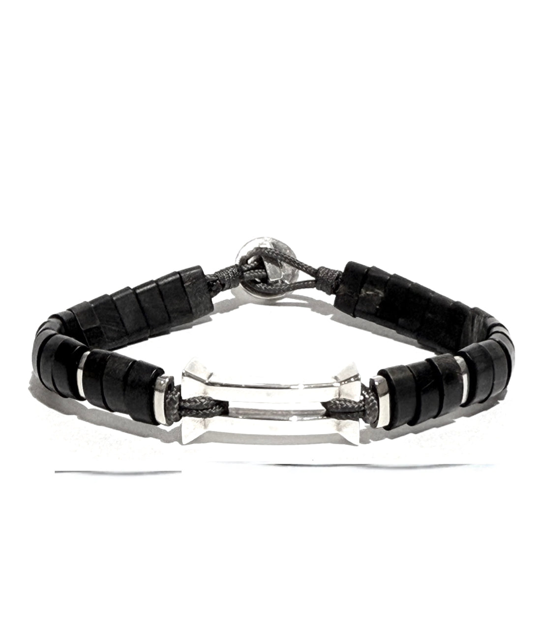 The Kenzo men’s bracelet features a striking inverted pyramid centerpiece in high-polish sterling silver, accented with hand-cut horn.