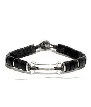 The Kenzo men’s bracelet features a striking inverted pyramid centerpiece in high-polish sterling silver, accented with hand-cut horn.