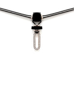  Niru Horn necklace in 18k white gold — oblong pavé diamond pendant suspended from hand-cut horn on grey parachute cord, white background