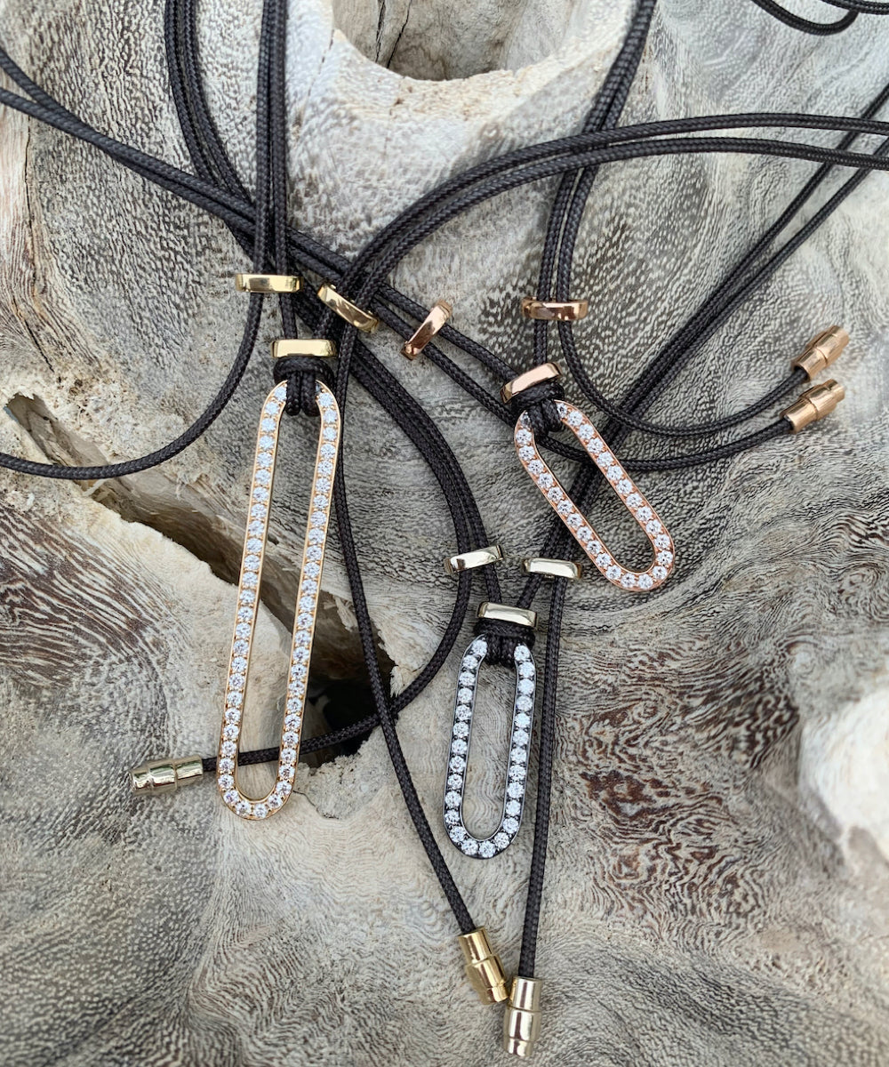 Niru Pendant – 18kt gold oval link pendant with diamonds on gray parachute cord, handmade women’s jewelry by ZADEH