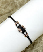 Cord bracelet with horn and rose gold elements
