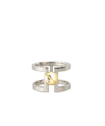 The Celine Ring combines high-polish sterling silver with an 18k gold accent
