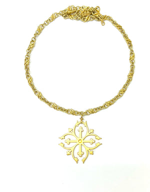 Medieval cross design hanging from a chain made of small infinity links in 18kt gold, handcrafted in NYC. Sapphire and diamonds are encrusted in the tips of the cross.