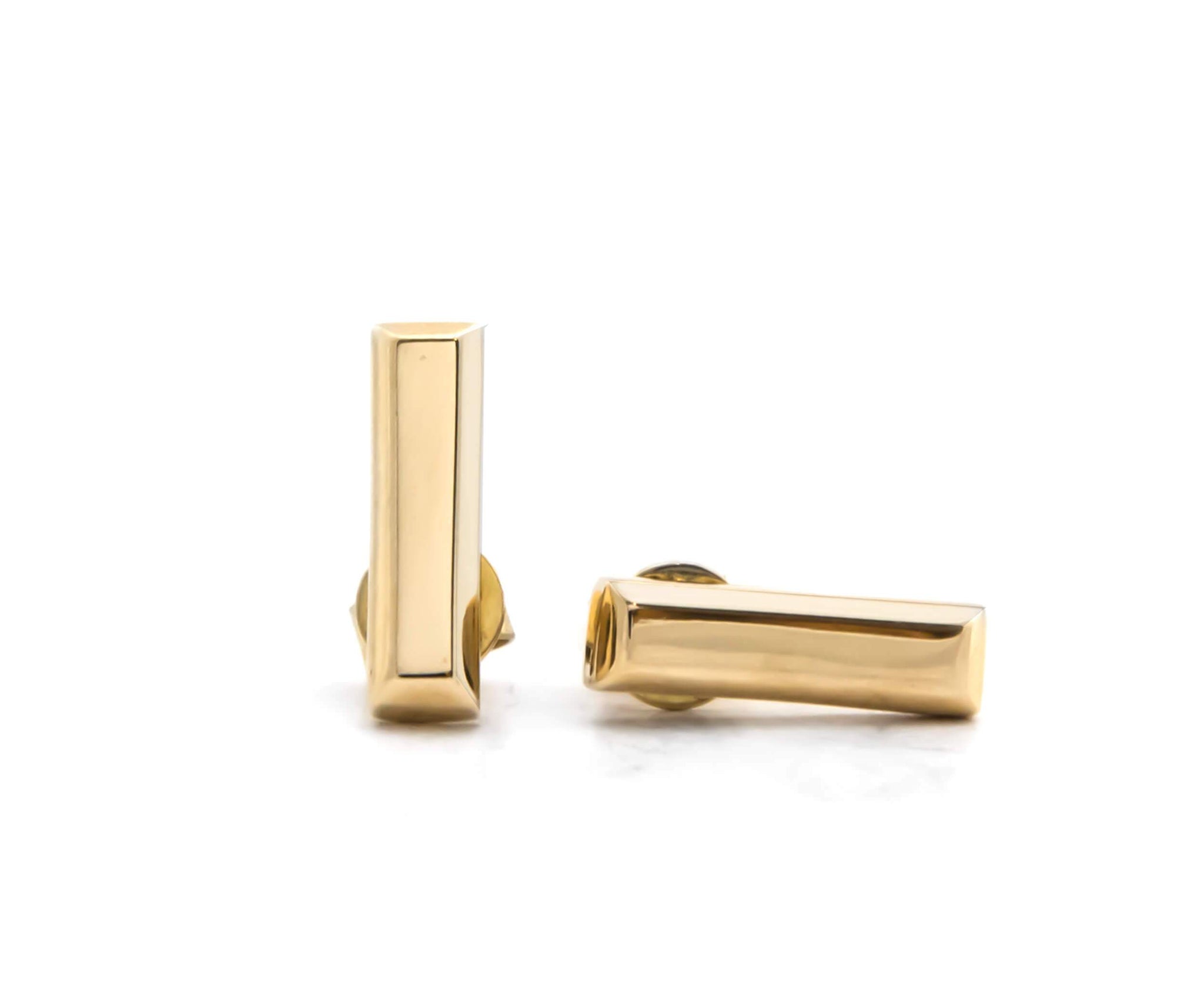 Sleek and sculptural, these 18K yellow gold long pyramid earrings on a post are timeless, chic, and effortlessly stylish—perfect for day-to-night sophistication.