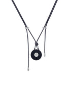 Round buffalo horn pendant with an 18kt white gold screw detail, draped on an adjustable parachute cord with 18kt gold end caps.  Wear this chic and modern piece with jeans or your best little black dress.  It can be worn in the shower, pool or ocean.