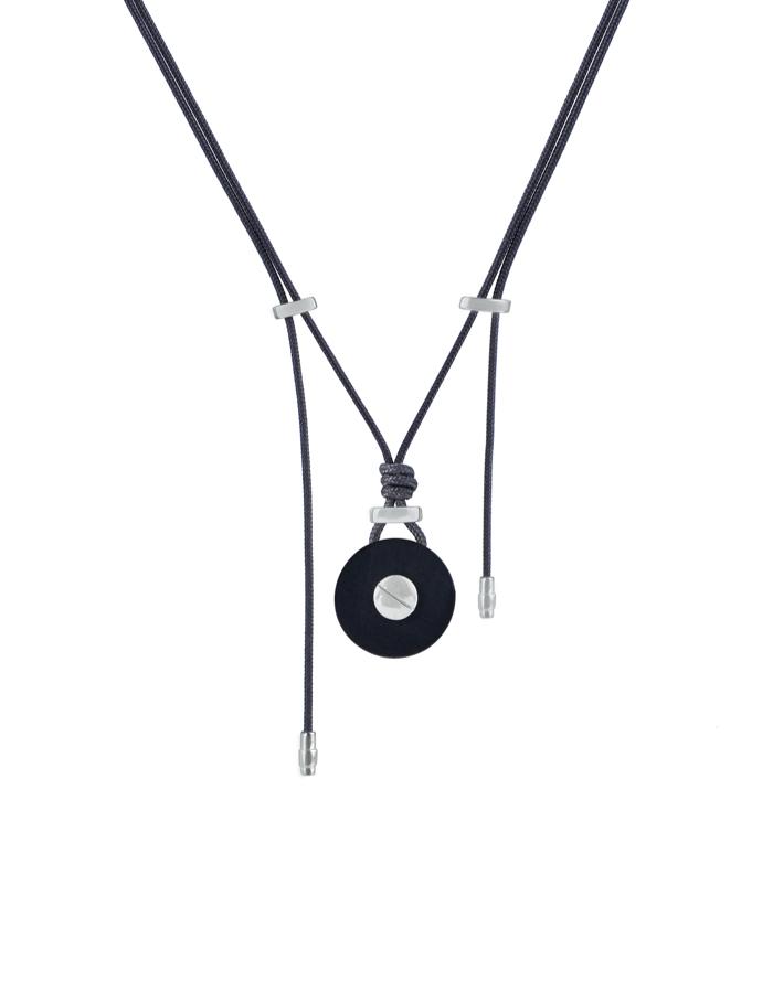 Round buffalo horn pendant with an 18kt white gold screw detail, draped on an adjustable parachute cord with 18kt gold end caps.  Wear this chic and modern piece with jeans or your best little black dress.  It can be worn in the shower, pool or ocean.