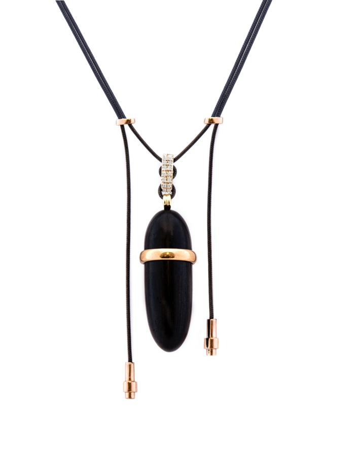 Elongated wood pendant with 18K pink gold and diamond accents on parachute cord — a versatile piece to wear casually or with formal attire.