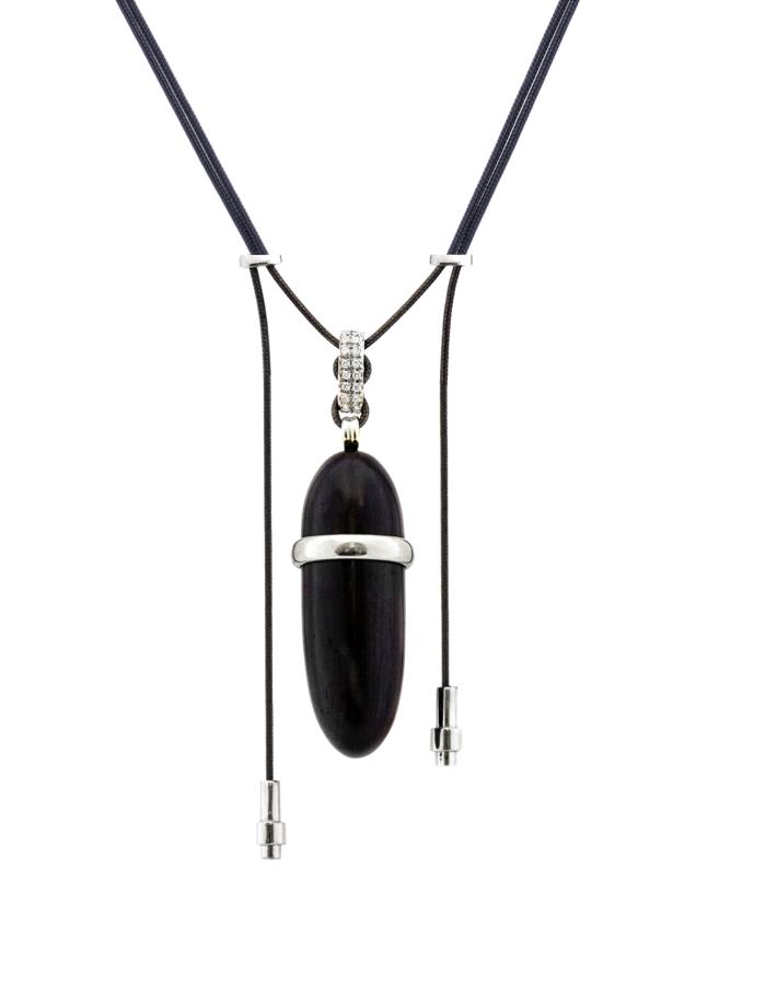 Elongated wood pendant with 18K white gold and diamond accents on parachute cord — a versatile piece to wear casually or with formal attire.