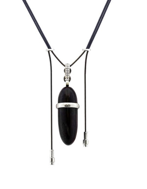 Elongated wood pendant with 18K white gold and diamond accents on parachute cord — a versatile piece to wear casually or with formal attire.